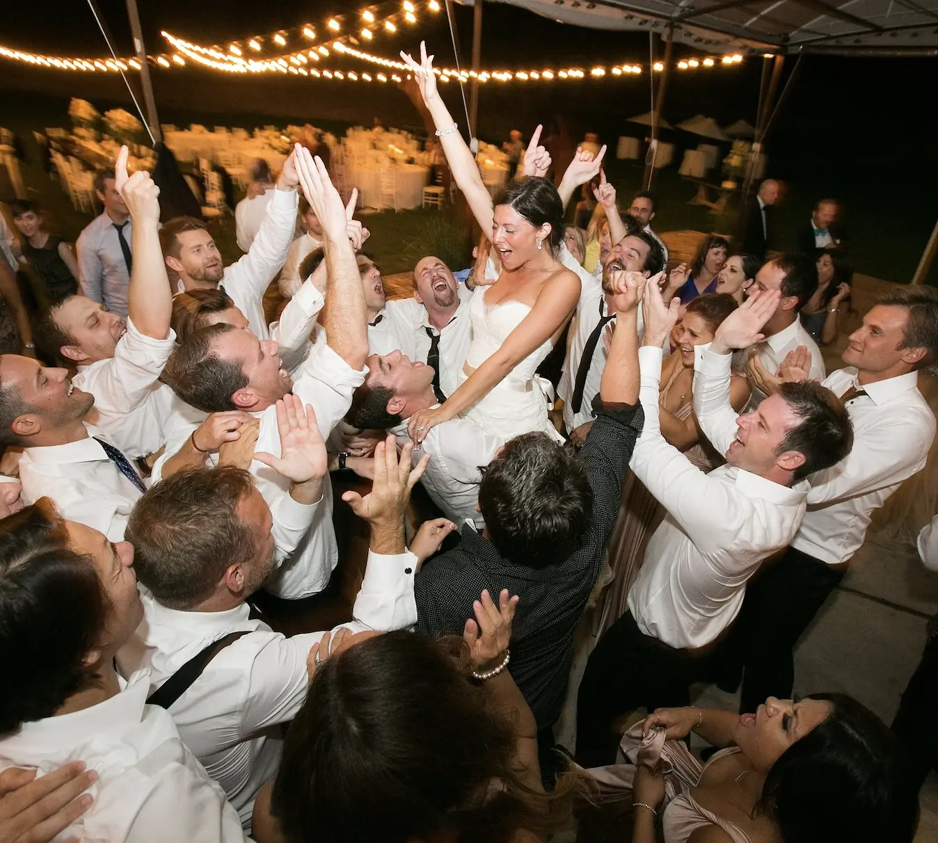 wedding dj watching bride lifted up